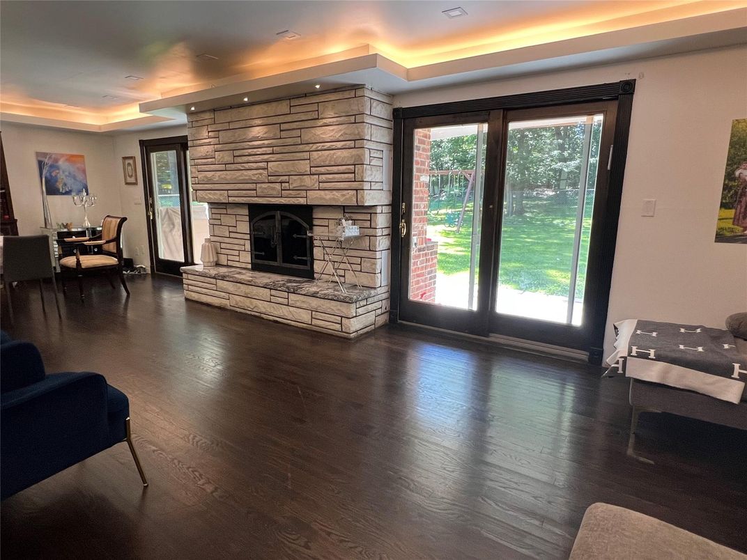Dining room, Fireplace, Interior, Recessed Lighting, Stone Walls, Wood Texture Flooring