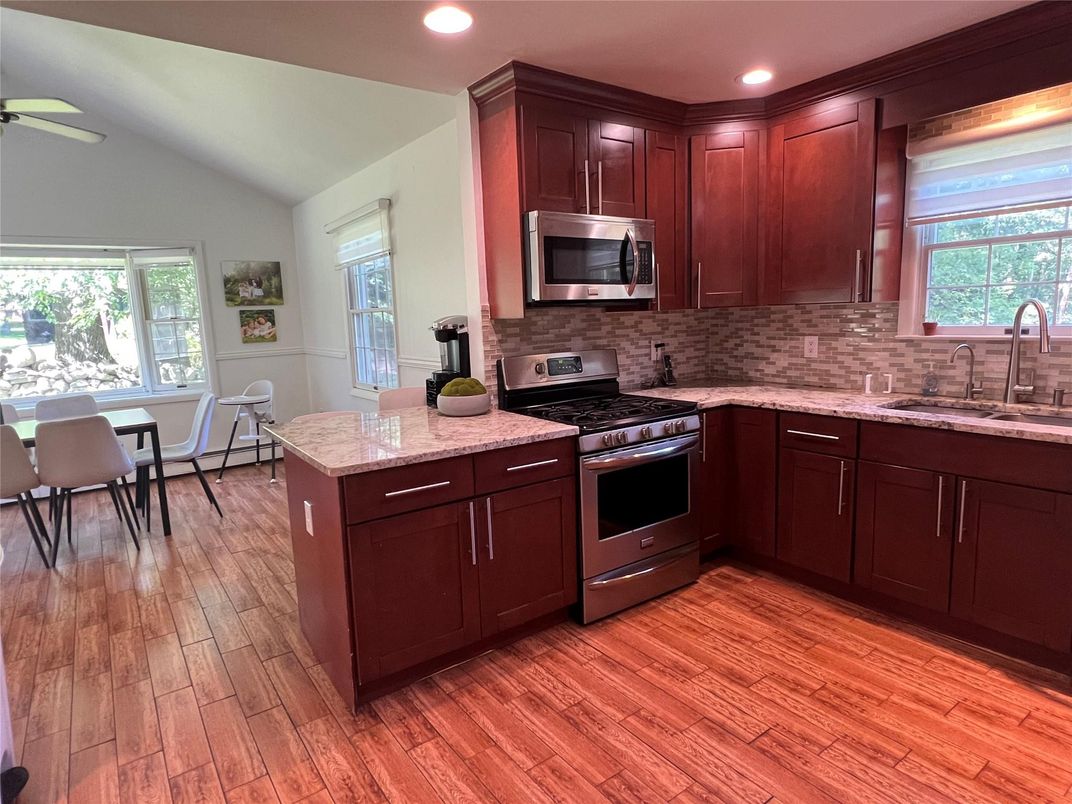 Dining room, Interior, Kitchen, Recessed Lighting, Stainless Steel Appliances, Wood Texture Flooring