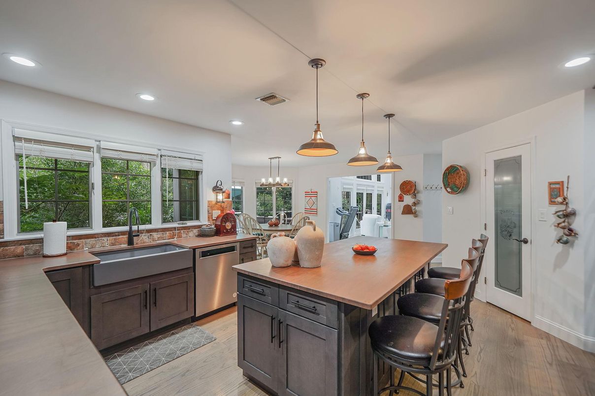 Dining room, Interior, Kitchen, Pendant Lights, Recessed Lighting, Stainless Steel Appliances, Wood Texture Flooring