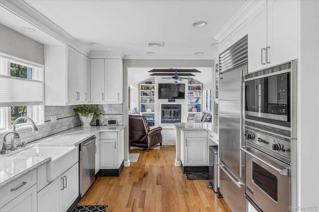 Fireplace, Interior, Kitchen, Recessed Lighting, Stainless Steel Appliances, Wood Texture Flooring