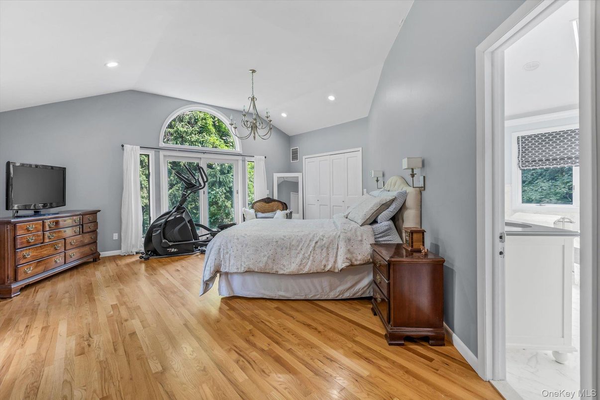 Bedroom, Chandelier, Fitness Equipment, Interior, Recessed Lighting, Wood Texture Flooring