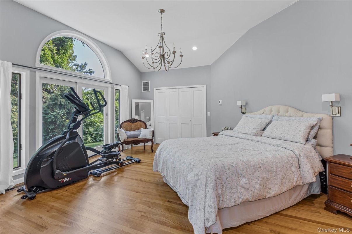 Bedroom, Chandelier, Fitness Equipment, Interior, Recessed Lighting, Wood Texture Flooring