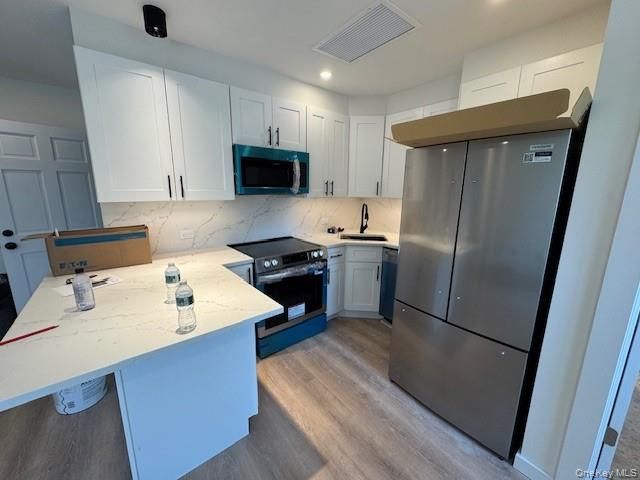 Interior, Kitchen, Marble Walls, Recessed Lighting, Stainless Steel Appliances, Wood Texture Flooring