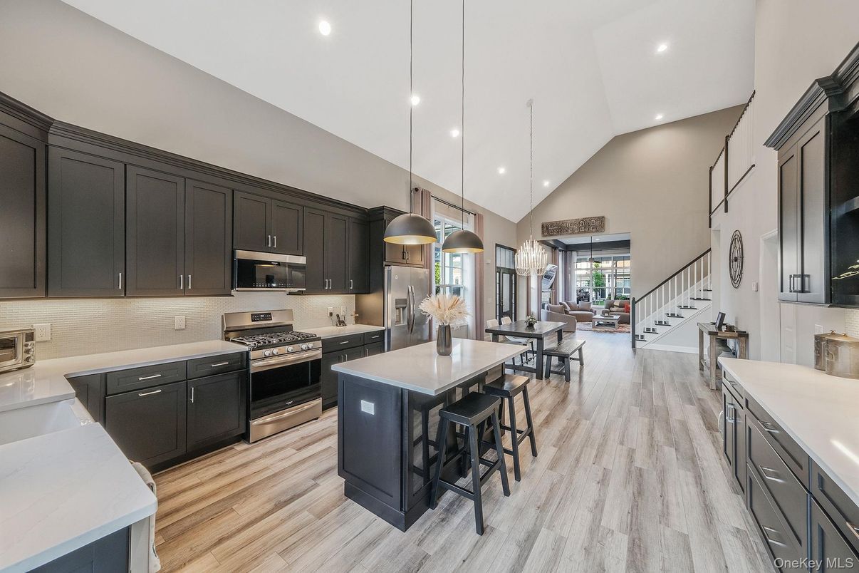 Dining room, Interior, Kitchen, Pendant Lights, Recessed Lighting, Stainless Steel Appliances, Wood Texture Flooring