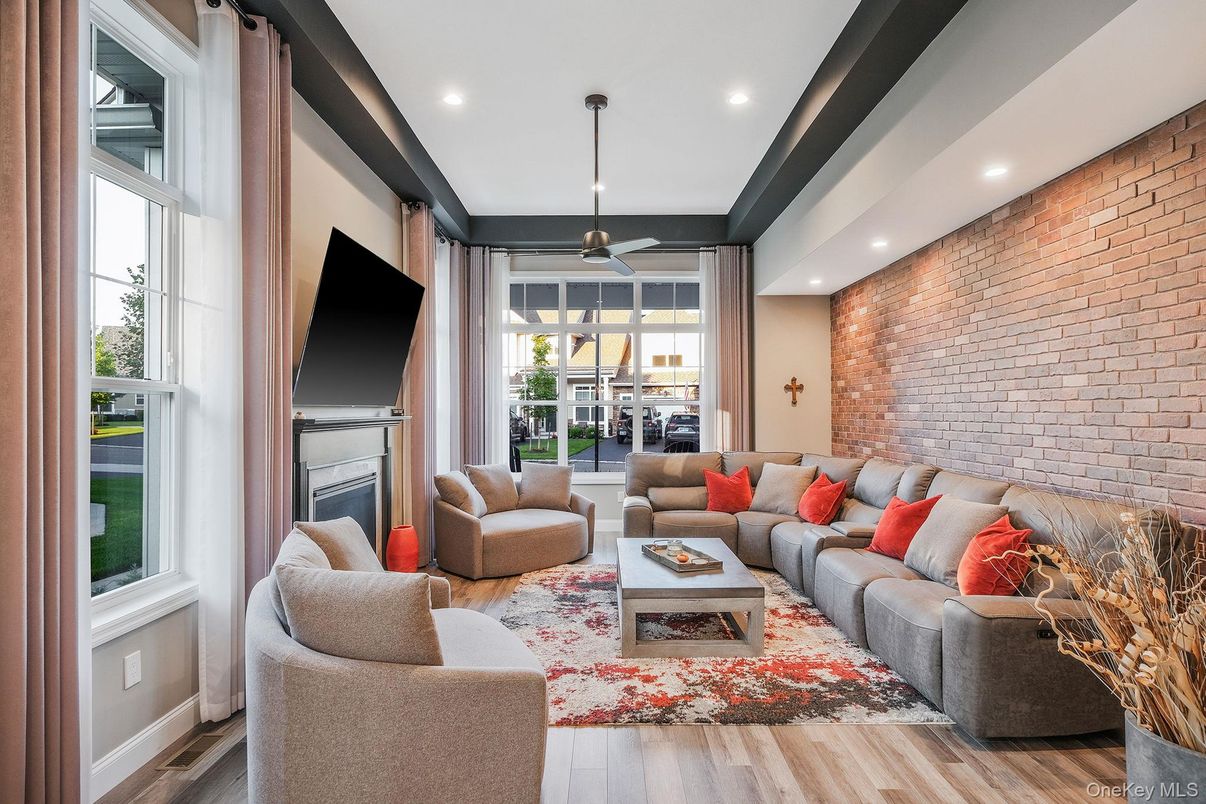 Fireplace, Interior, Living room, Recessed Lighting, Stone Walls, Wood Texture Flooring