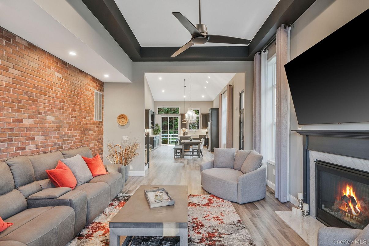 Dining room, Fireplace, Interior, Living room, Pendant Lights, Recessed Lighting, Stone Walls, Wood Texture Flooring