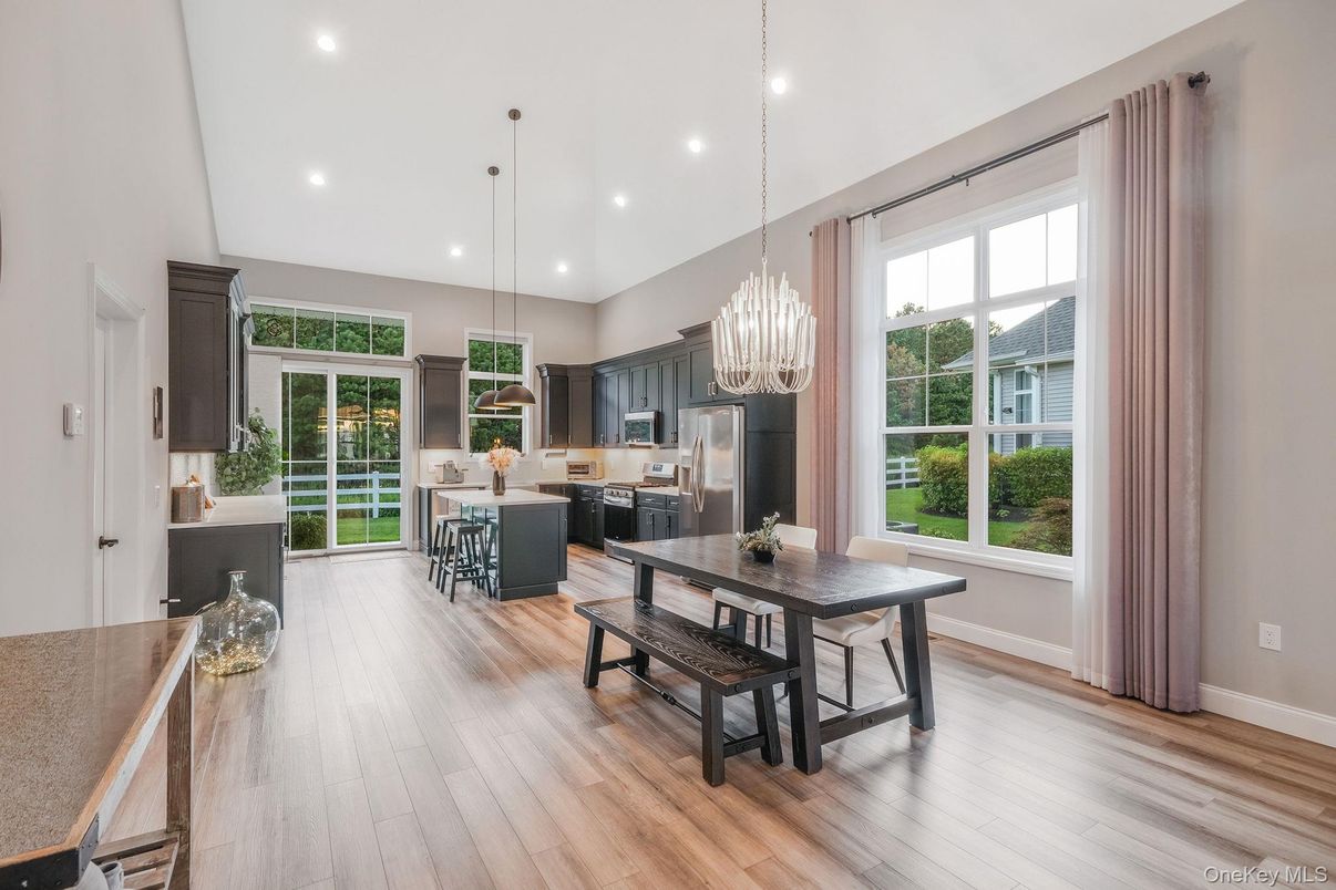 Chandelier, Dining room, Interior, Kitchen, Pendant Lights, Recessed Lighting, Stainless Steel Appliances, Wood Texture Flooring