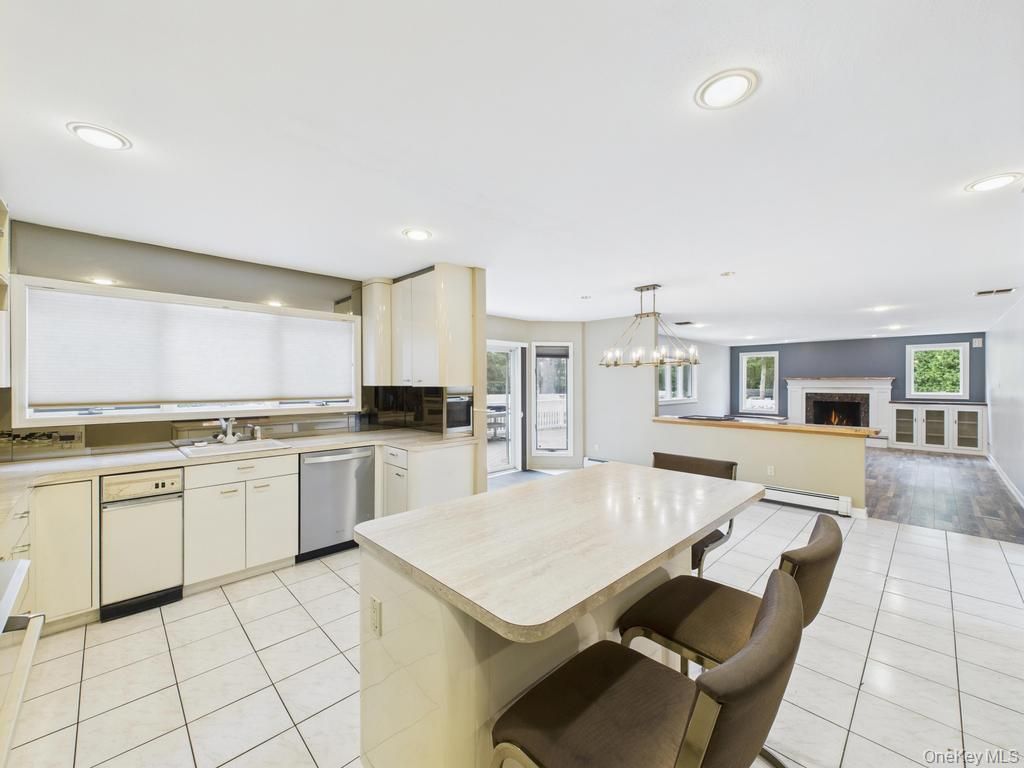 Dining room, Fireplace, Interior, Kitchen, Pendant Lights, Recessed Lighting, Stainless Steel Appliances