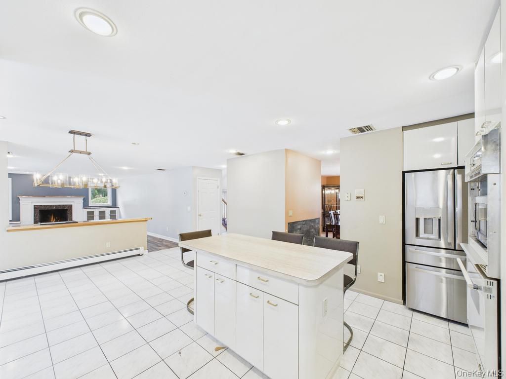 Fireplace, Interior, Kitchen, Pendant Lights, Recessed Lighting, Stainless Steel Appliances