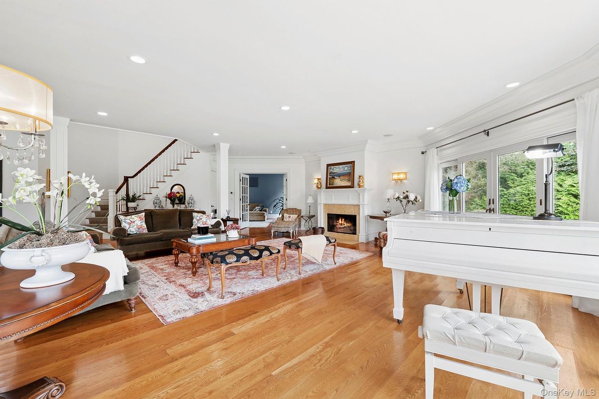 Fireplace, Interior, Living room, Piano, Recessed Lighting, Wood Texture Flooring