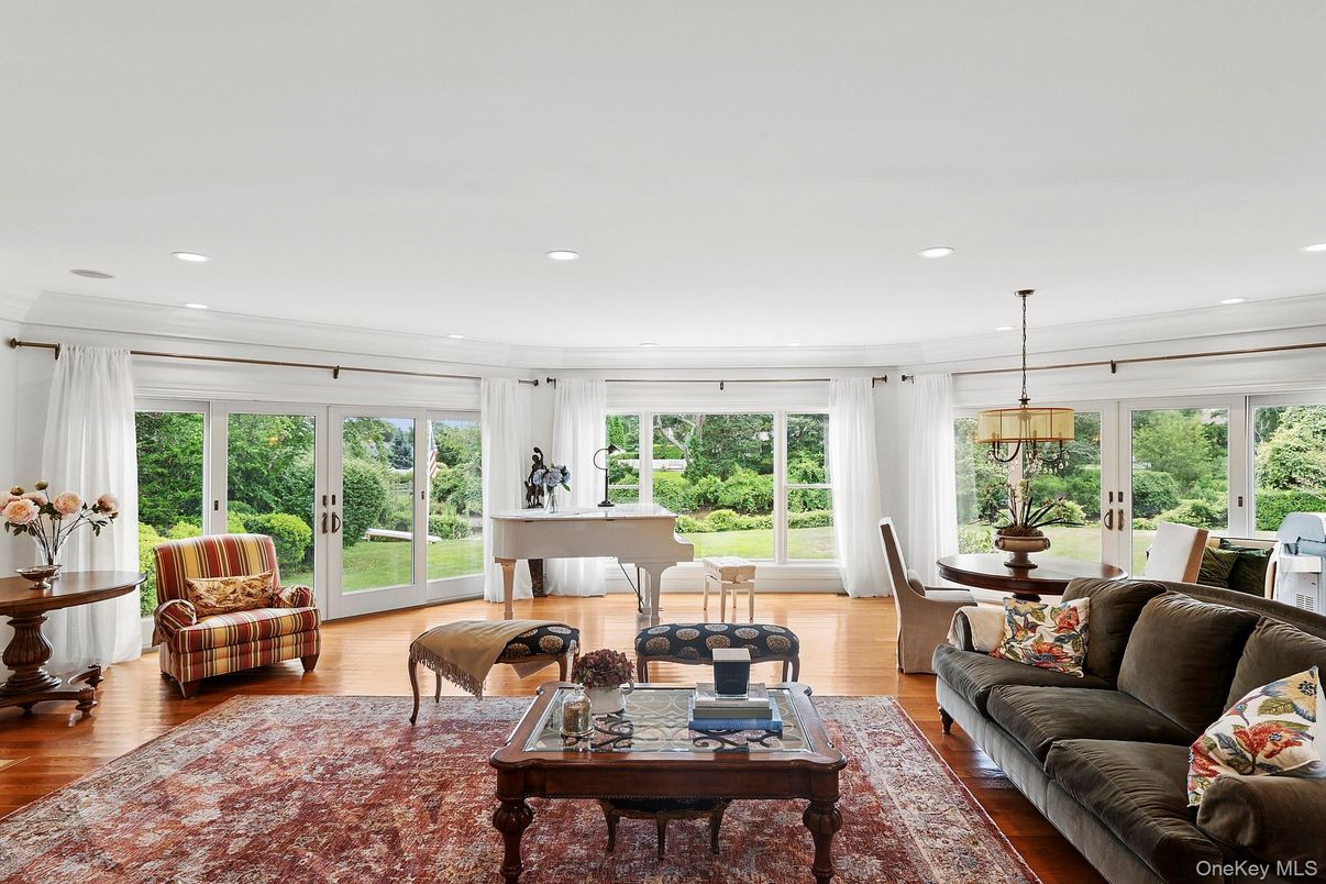 Dining room, Interior, Living room, Pendant Lights, Piano, Recessed Lighting, Wood Texture Flooring