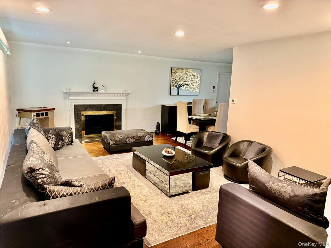 Dining room, Fireplace, Interior, Living room, Recessed Lighting, Wood Texture Flooring