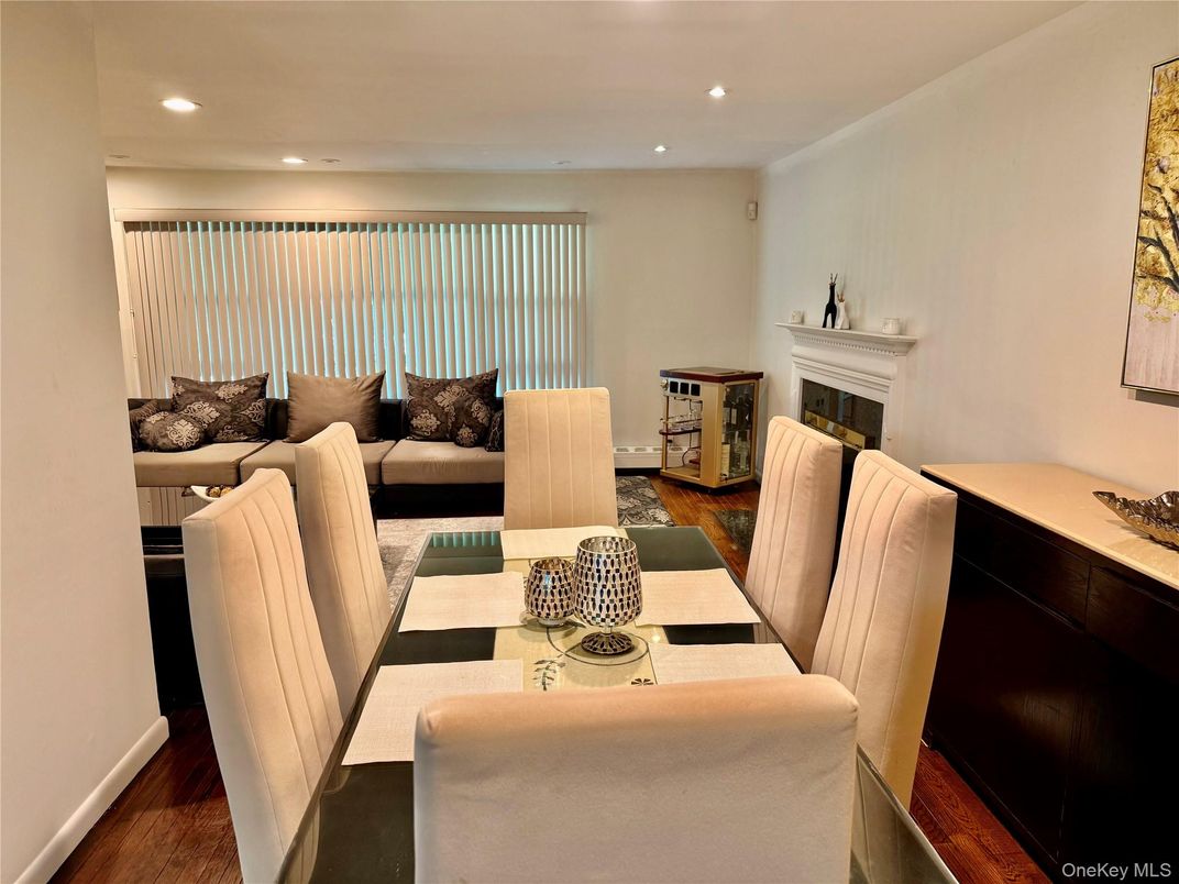 Dining room, Fireplace, Interior, Living room, Recessed Lighting, Wood Texture Flooring