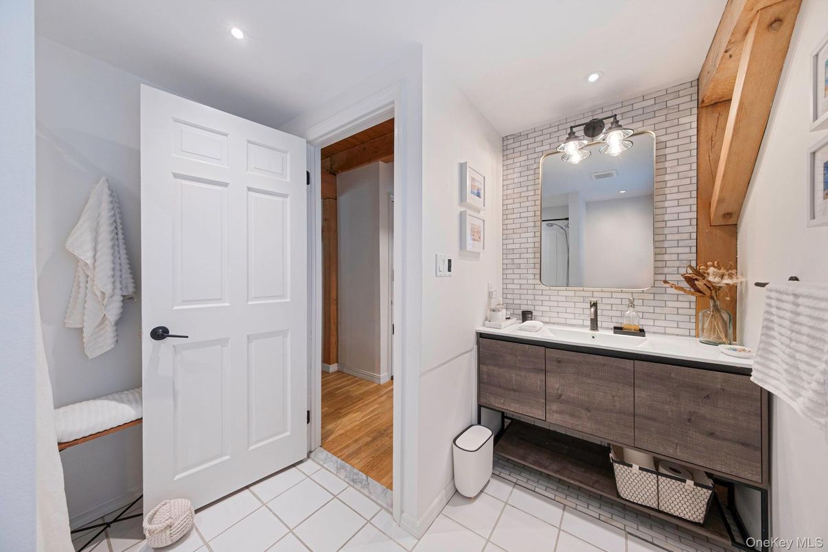 Bathroom, Dual Sink Vanities, Interior, Recessed Lighting, Wood Texture Flooring