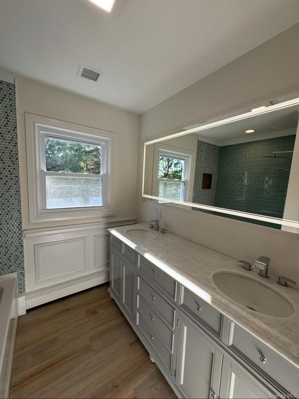Bathroom, Dual Sink Vanities, Interior, Recessed Lighting, Wood Texture Flooring