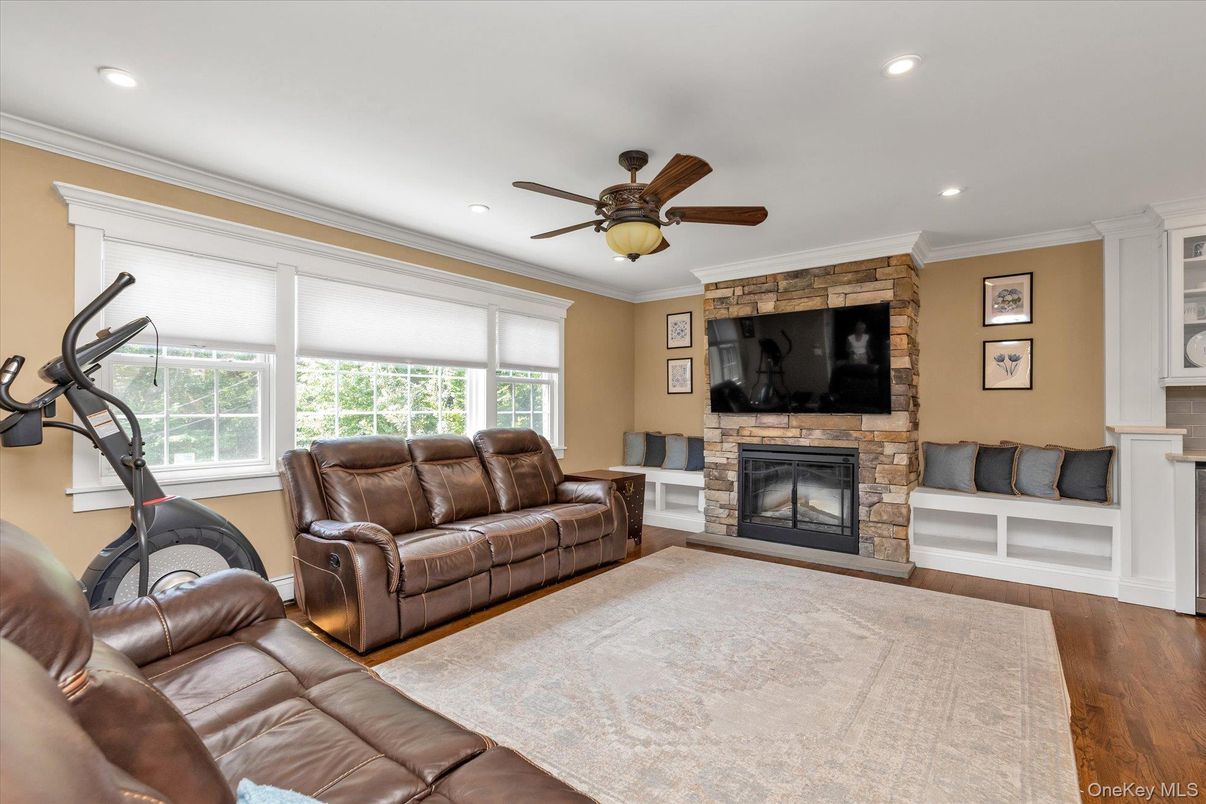 Fireplace, Fitness Equipment, Interior, Living room, Recessed Lighting, Wood Texture Flooring