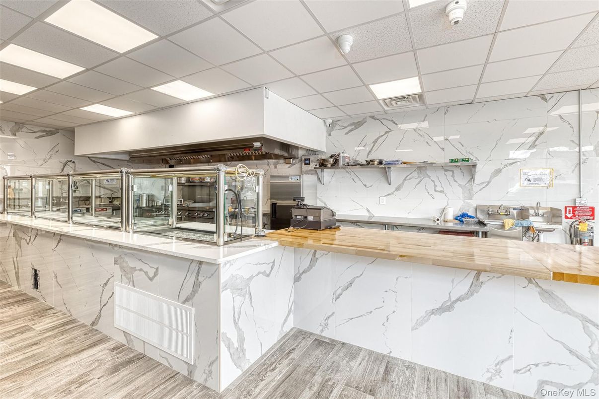 Interior, Kitchen, Marble Walls, Recessed Lighting, Stainless Steel Appliances