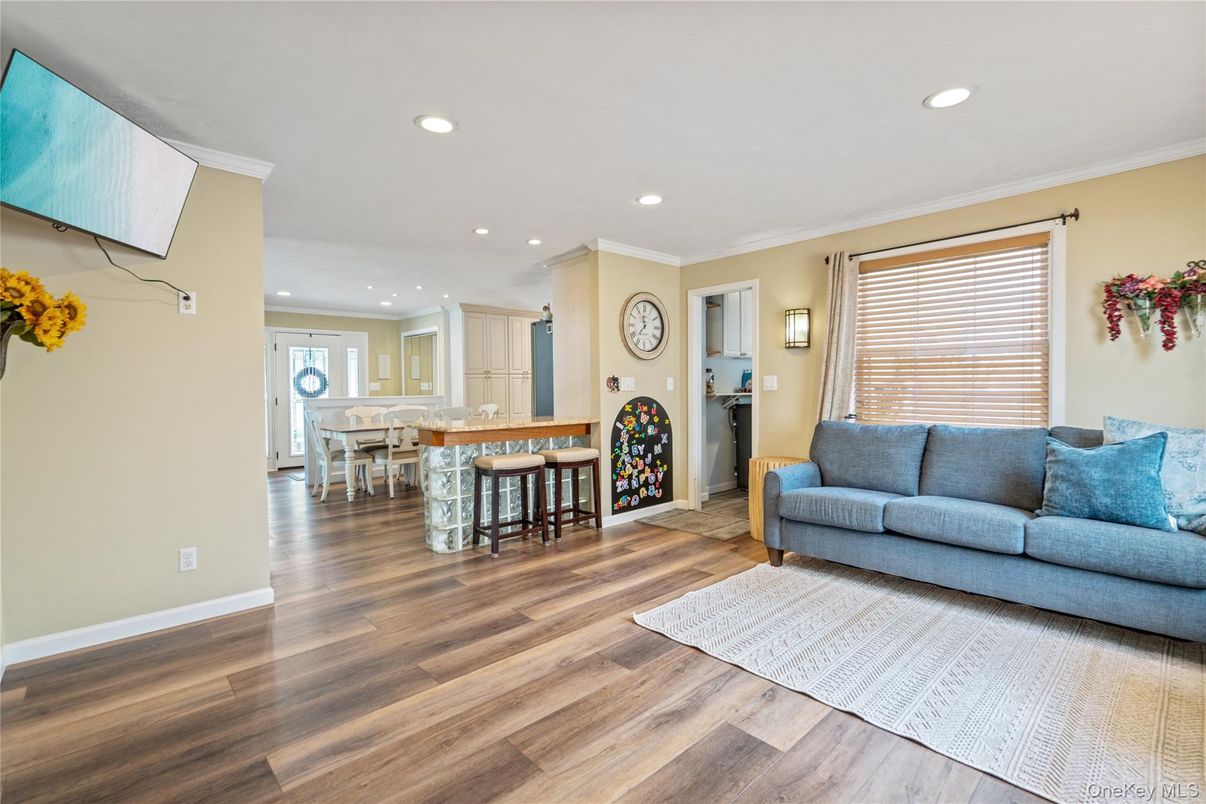 Dining room, Fireplace, Interior, Living room, Recessed Lighting, Wood Texture Flooring