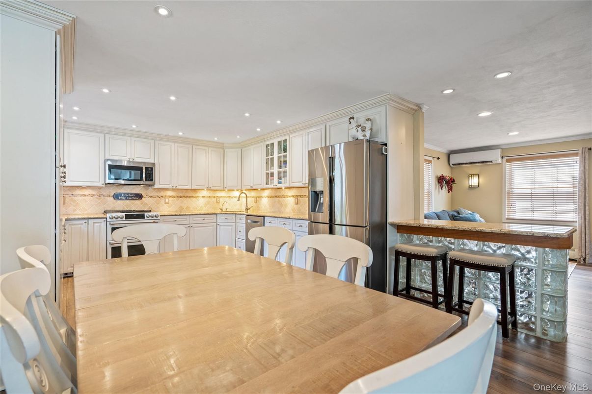 Dining room, Interior, Kitchen, Recessed Lighting, Stainless Steel Appliances, Wood Texture Flooring