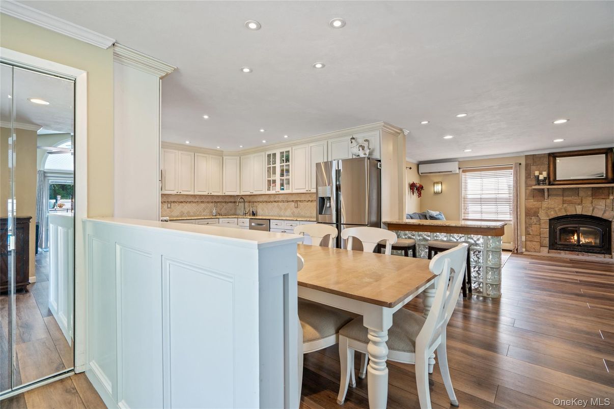 Dining room, Fireplace, Interior, Kitchen, Pendant Lights, Recessed Lighting, Stone Walls, Wood Texture Flooring