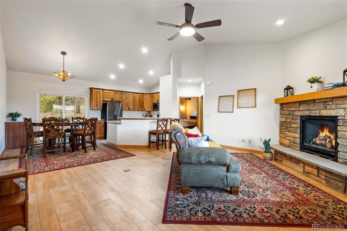 Dining room, Fireplace, Interior, Kitchen, Pendant Lights, Recessed Lighting, Wood Texture Flooring