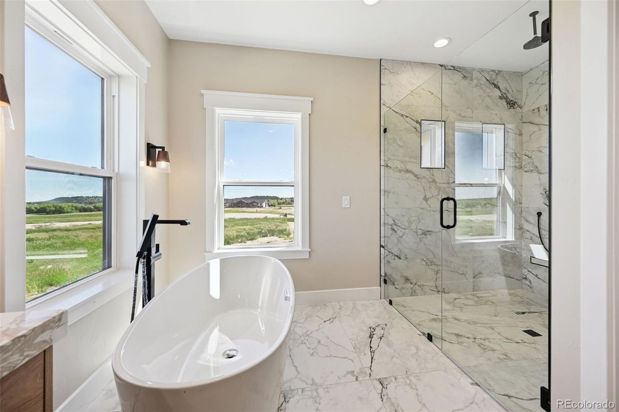 Bathroom, Free Standing Baths, Glass Shower, Interior, Marble, Marble Walls, Recessed Lighting, Water