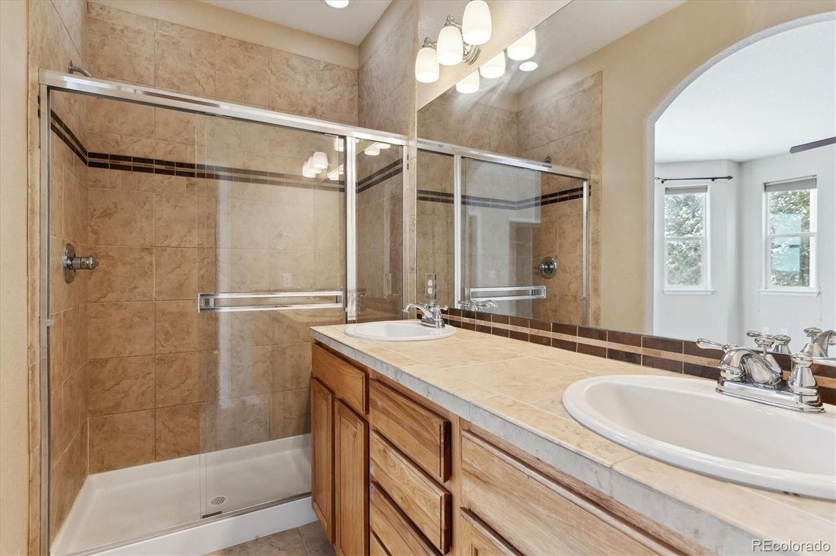 Bathroom, Dual Sink Vanities, Glass Shower, Interior, Recessed Lighting, Tile Countertops