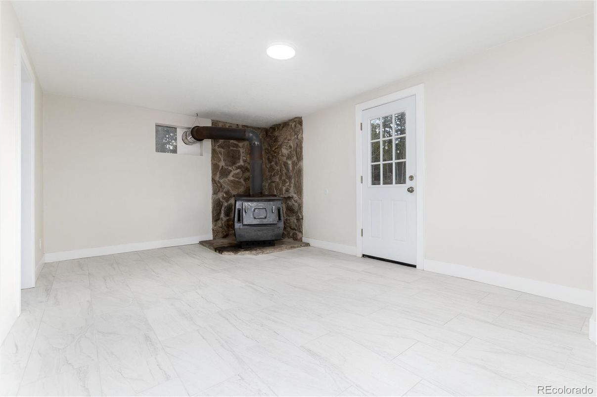 Empty room, Fireplace, Interior, Marble, Recessed Lighting, Stone Walls