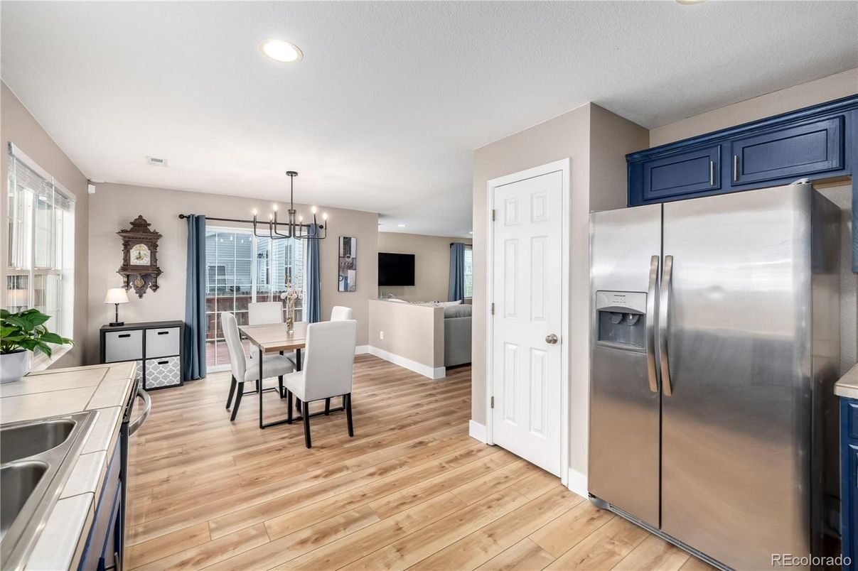 Dining room, Interior, Kitchen, Pendant Lights, Recessed Lighting, Stainless Steel Appliances, Wood Texture Flooring