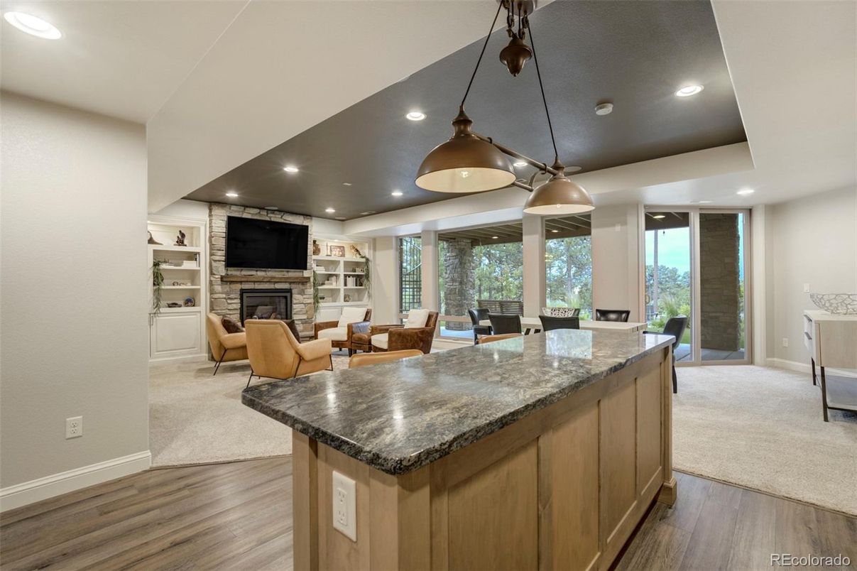 Dining room, Fireplace, Interior, Living room, Pendant Lights, Recessed Lighting, Wood Texture Flooring