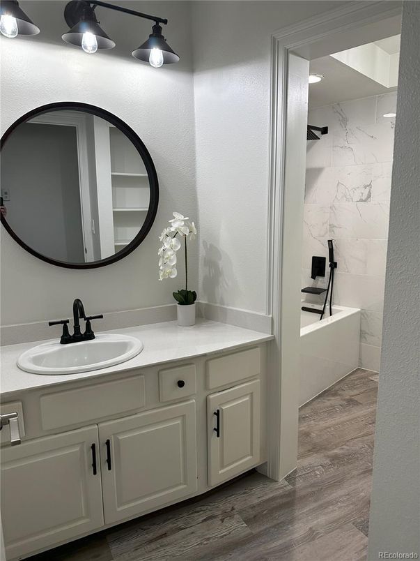 Bathroom, Dual Sink Vanities, Interior, Marble Walls, Wood Texture Flooring