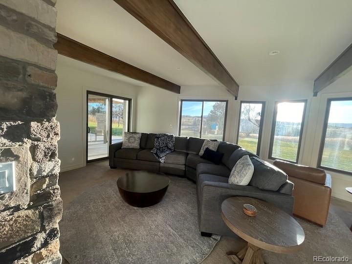 Fireplace, Interior, Living room, Recessed Lighting, Stone Walls, Water, Wooden Beams