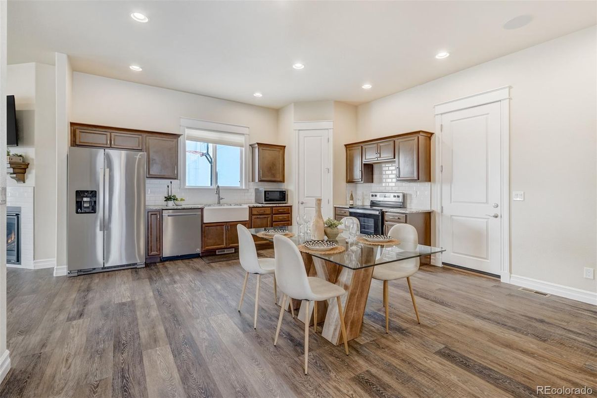 Dining room, Interior, Kitchen, Recessed Lighting, Stainless Steel Appliances, Wood Texture Flooring