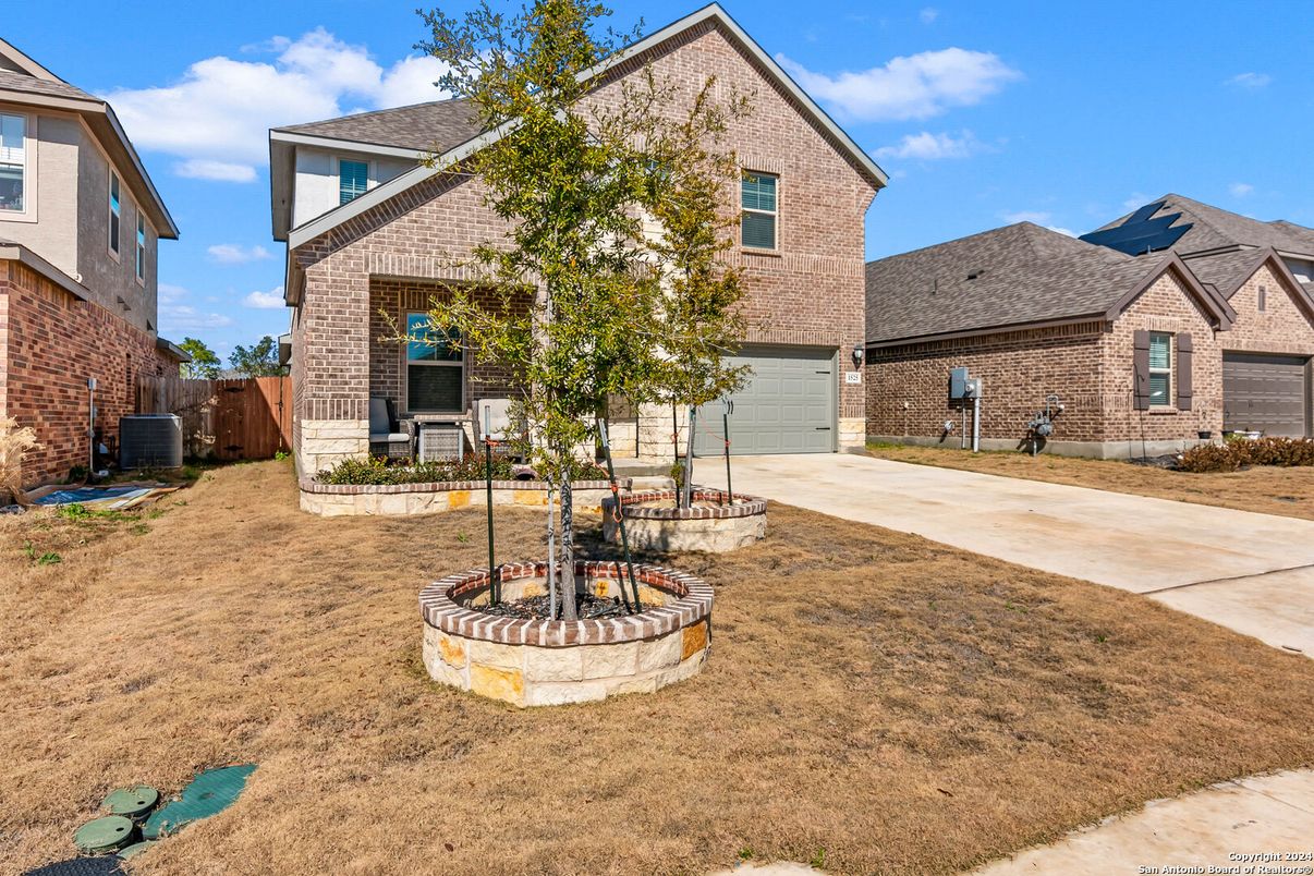 Attached, Backyard, Exterior, Facade, Brick Facade, Brick Traditional
