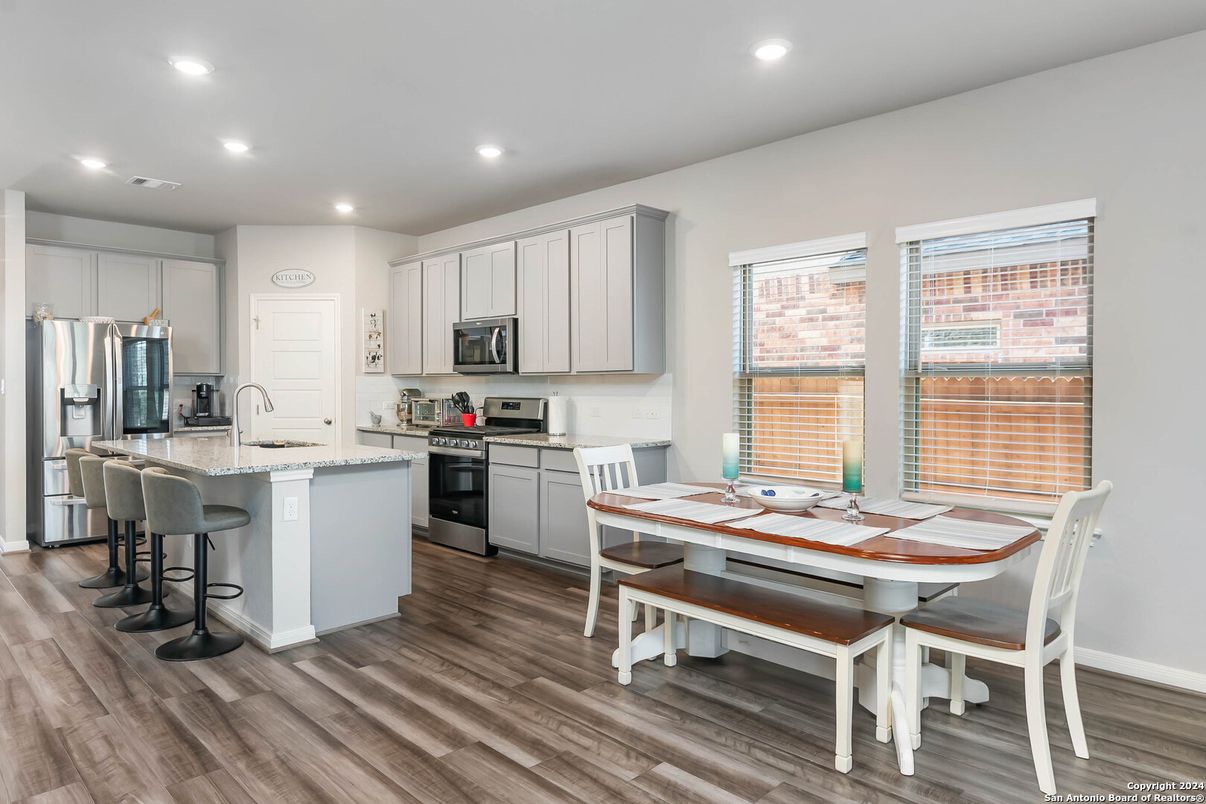Dining room, Interior, Kitchen, Recessed Lighting, Stainless Steel Appliances, Wood Texture Flooring