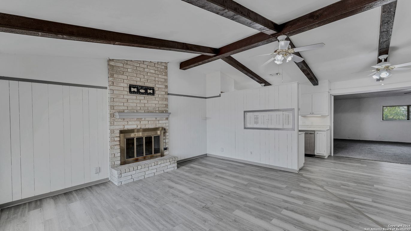 Empty room, Fireplace, Interior, Stone Walls, Wooden Beams, Wood Texture Flooring