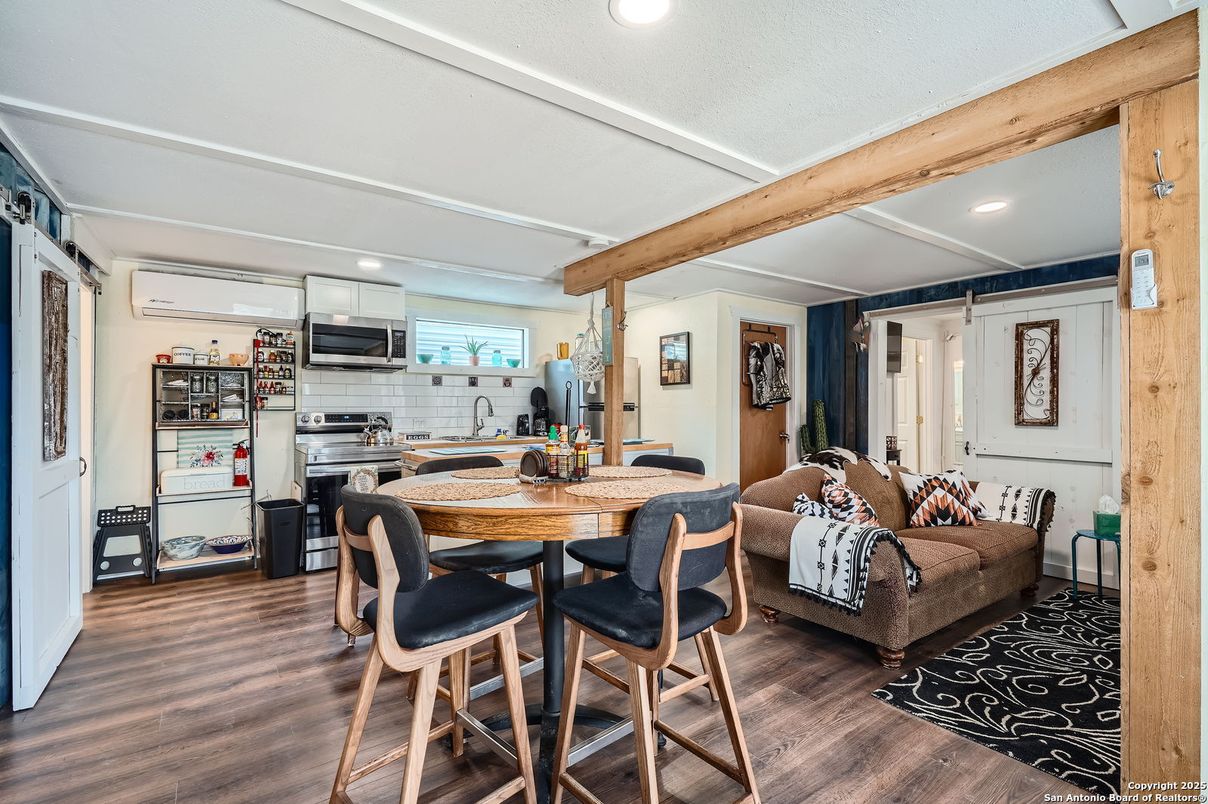Dining room, Interior, Kitchen, Living room, Recessed Lighting, Stainless Steel Appliances, Wooden Beams, Wood Texture Flooring