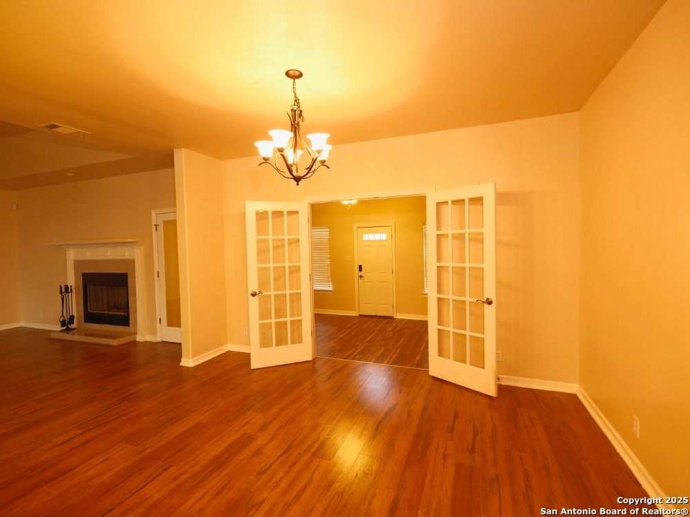 Chandelier, Empty room, Fireplace, Interior, Wood Texture Flooring
