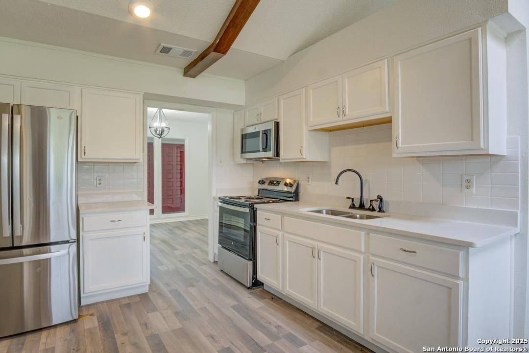 Chandelier, Interior, Kitchen, Recessed Lighting, Stainless Steel Appliances, Wooden Beams, Wood Texture Flooring