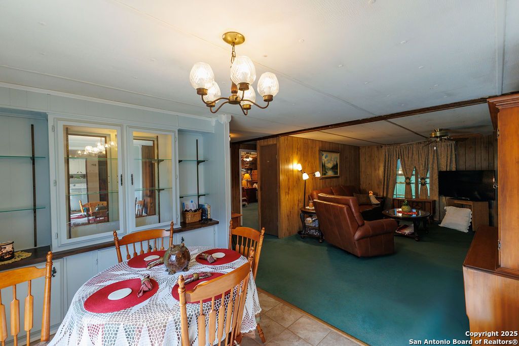 Chandelier, Dining room, Fireplace, Interior, Living room, Wooden Walls