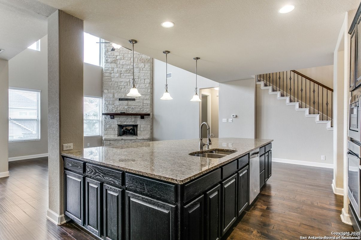 Fireplace, Interior, Kitchen, Pendant Lights, Recessed Lighting, Stone Walls, Wood Texture Flooring