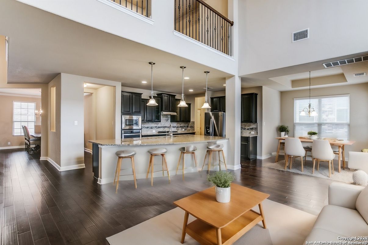 Dining room, Interior, Kitchen, Pendant Lights, Recessed Lighting, Stainless Steel Appliances, Wood Texture Flooring