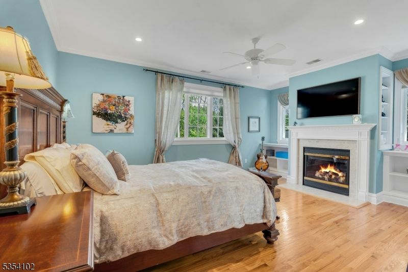 Bedroom, Fireplace, Interior, Recessed Lighting, Wood Texture Flooring