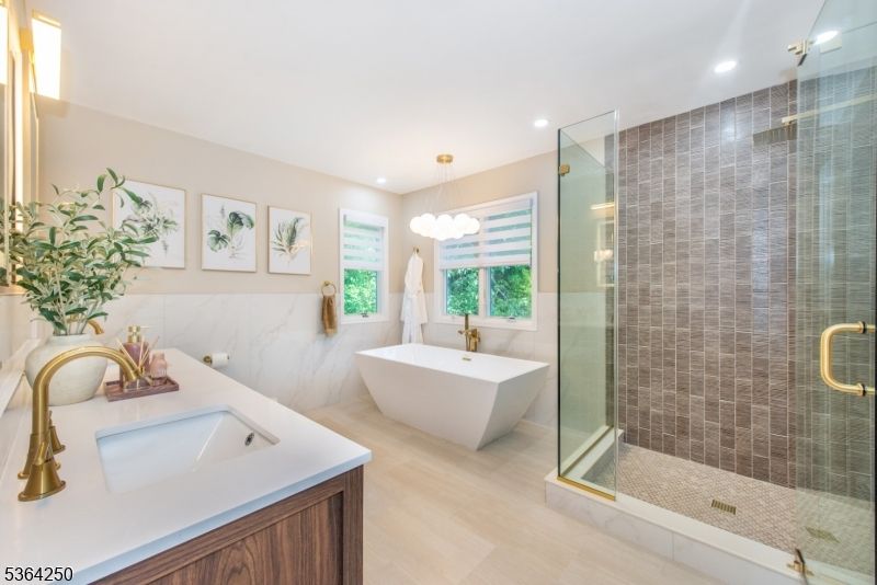 Bathroom, Dual Sink Vanities, Free Standing Baths, Glass Shower, Interior, Pendant Lights, Recessed Lighting, Wood Texture Flooring