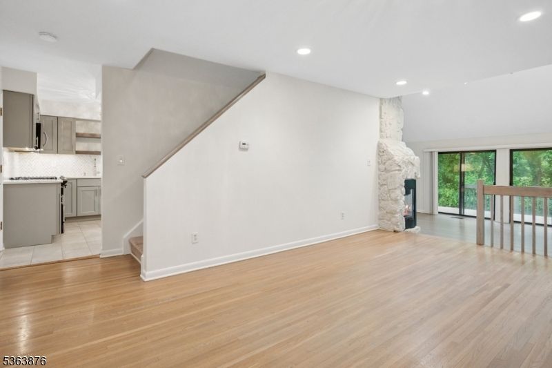 Empty room, Fireplace, Interior, Kitchen, Recessed Lighting, Wood Texture Flooring