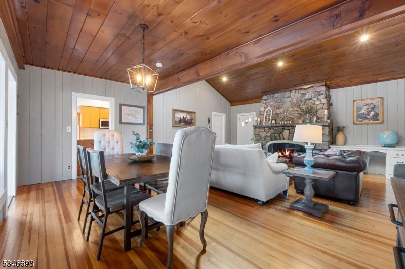 Dining room, Fireplace, Interior, Living room, Pendant Lights, Stone Walls, Wooden Beams, Wooden Ceilings, Wood Texture Flooring