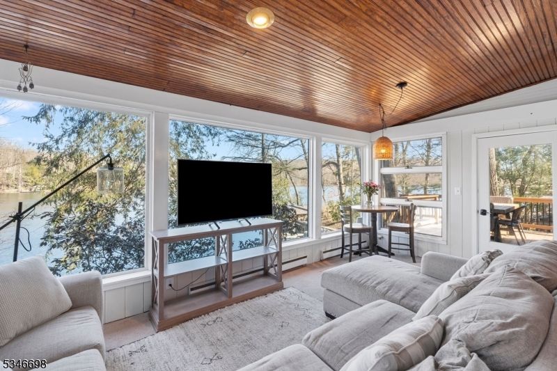 Dining room, Interior, Living room, Pendant Lights, Recessed Lighting, Sun Room, Wooden Ceilings, Wood Texture Flooring