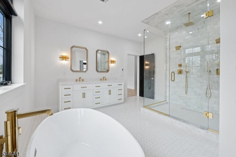 Bathroom, Dual Sink Vanities, Free Standing Baths, Glass Shower, Interior, Marble Walls, Recessed Lighting