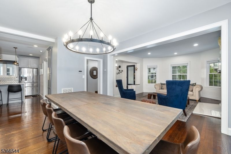 Chandelier, Dining room, Interior, Kitchen, Living room, Pendant Lights, Recessed Lighting, Stainless Steel Appliances, Wood Texture Flooring