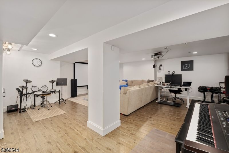Fitness Equipment, Home Office, Interior, Living room, Piano, Recessed Lighting, Wood Texture Flooring